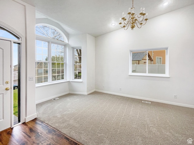 112 E Ama Fille Ln, Payson, UT 84651 - unfurnished dining area featuring baseboards, visible vents, a notable chandelier, lofted ceiling, and carpet floors
