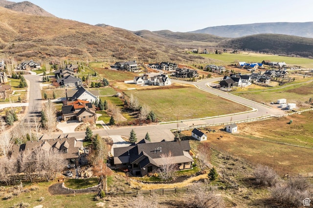 view of property location featuring a mountainous background and nearby suburban area