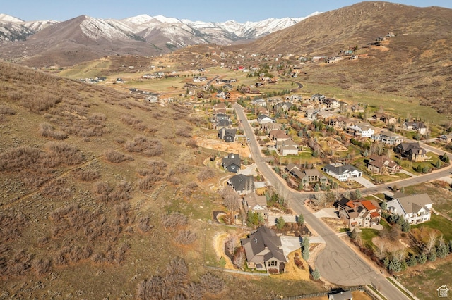 view of mountain background featuring nearby suburban area