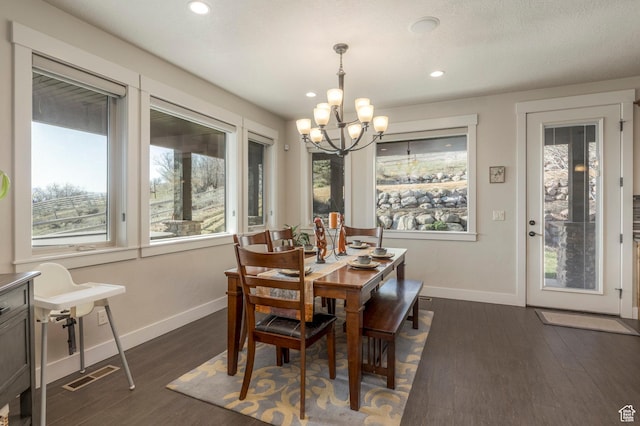 dining space featuring a chandelier, baseboards, dark wood-style flooring, and recessed lighting