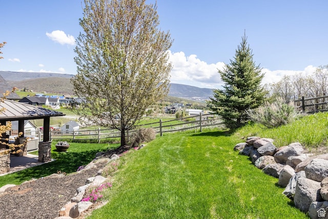view of yard featuring a gazebo and a mountain view