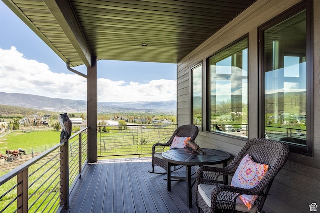 wooden deck with a mountain view