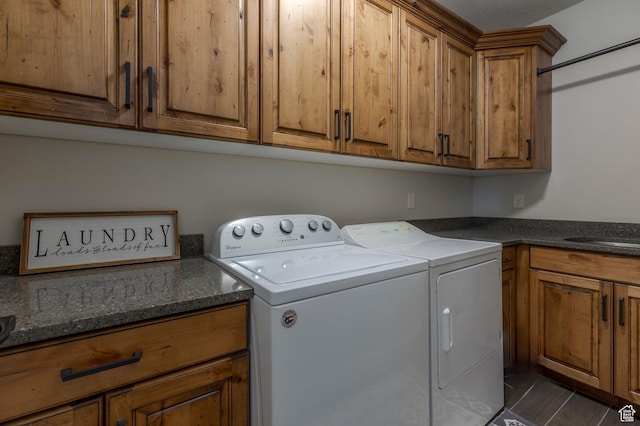 laundry area with washing machine and dryer and cabinet space