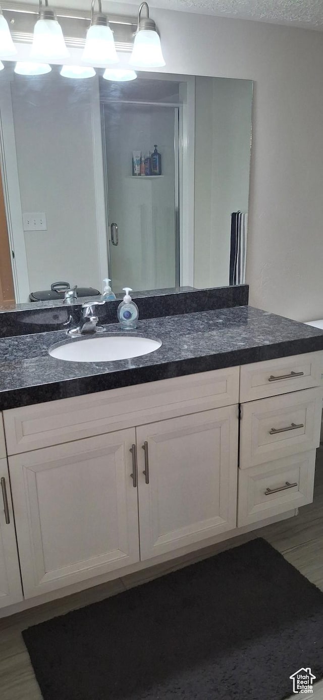 4502 S Stonington Way, Taylorsville, UT 84129 - bathroom with vanity and wood finished floors