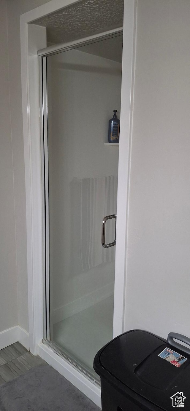 4502 S Stonington Way, Taylorsville, UT 84129 - bathroom with a shower stall and baseboards
