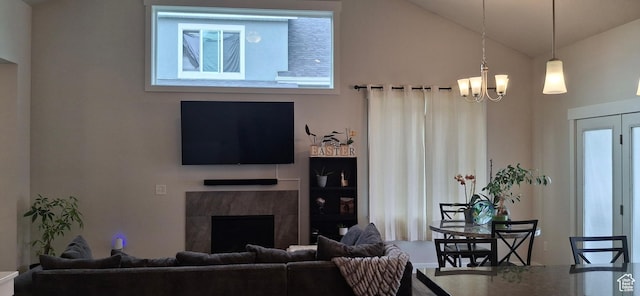 4502 S Stonington Way, Taylorsville, UT 84129 - living area featuring a fireplace, lofted ceiling, a healthy amount of sunlight, and an inviting chandelier