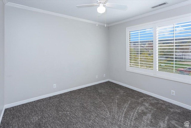 spare room with carpet flooring, baseboards, visible vents, a ceiling fan, and crown molding