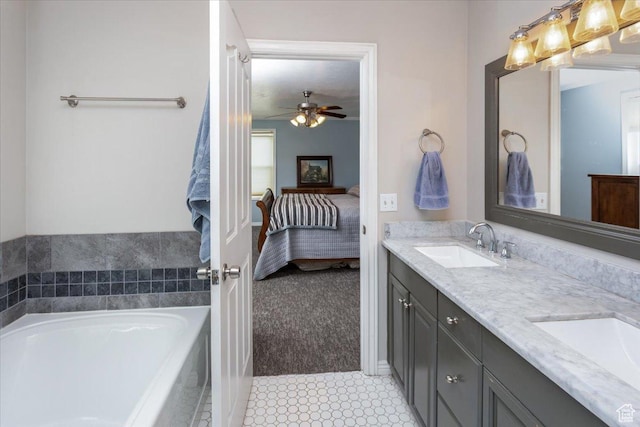 ensuite bathroom featuring a garden tub, a sink, double vanity, and connected bathroom