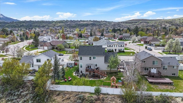 drone / aerial view with a residential view and a mountain view