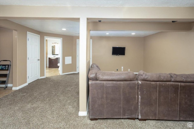living area featuring baseboards, carpet flooring, and recessed lighting