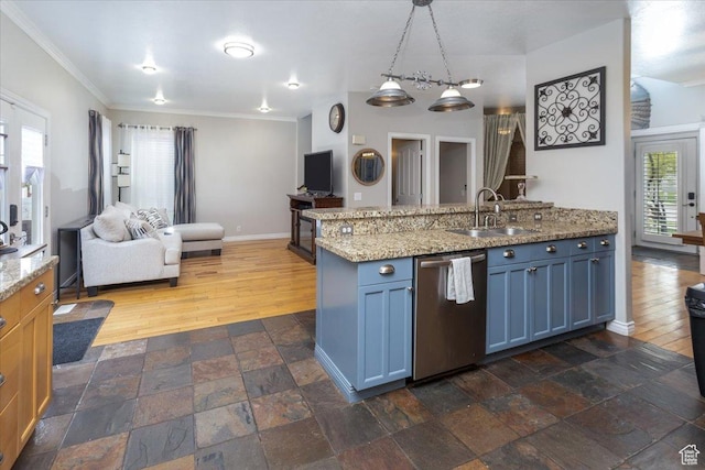 kitchen with stainless steel dishwasher, a sink, open floor plan, stone tile flooring, and ornamental molding