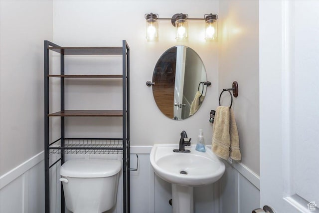 bathroom featuring toilet and a sink