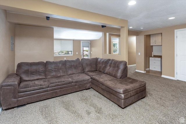 living room featuring recessed lighting, carpet, and baseboards