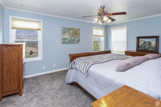 bedroom with ceiling fan, carpet, baseboards, and ornamental molding