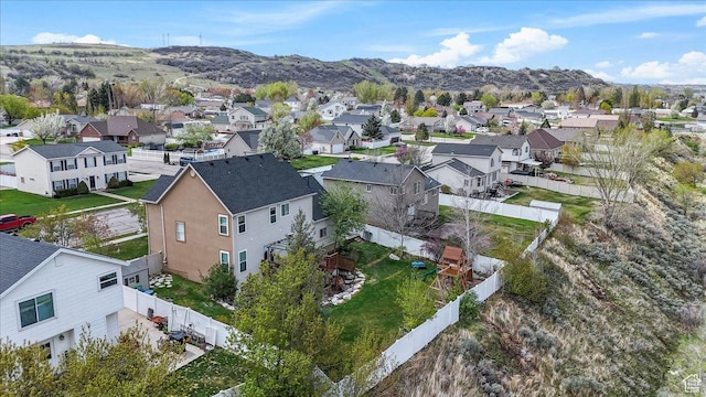 birds eye view of property with a mountain view and a residential view