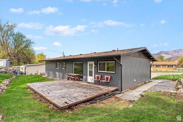 3315 Meadow Dr, Ogden, UT 84403 - back of property with a yard and a deck with mountain view