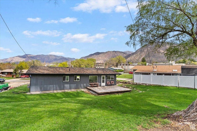 3315 Meadow Dr, Ogden, UT 84403 - back of house featuring a yard, a deck with mountain view, and fence