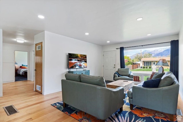3315 Meadow Dr, Ogden, UT 84403 - living area featuring baseboards, visible vents, recessed lighting, and light wood-style floors
