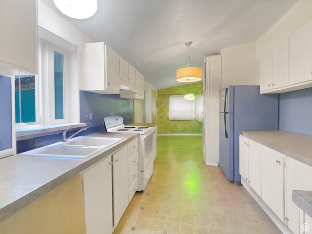 kitchen featuring light countertops, a sink, white appliances, decorative light fixtures, and white cabinetry