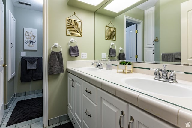 637 S Pine Meadow Ln, Tooele, UT 84074 - bathroom with tile patterned floors, a sink, visible vents, and double vanity
