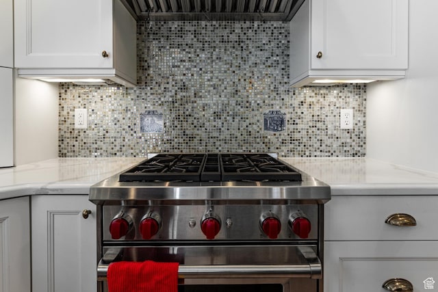 637 S Pine Meadow Ln, Tooele, UT 84074 - kitchen featuring backsplash, high end range, range hood, and white cabinets