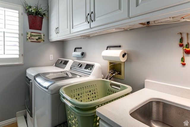 637 S Pine Meadow Ln, Tooele, UT 84074 - clothes washing area featuring cabinet space, independent washer and dryer, and baseboards