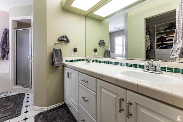 637 S Pine Meadow Ln, Tooele, UT 84074 - bathroom with double vanity, a stall shower, and a sink