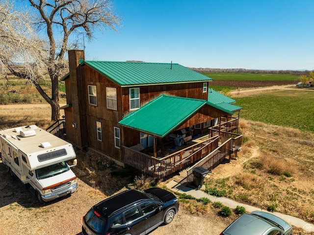 7413 W 7250 S, Myton, UT 84052 - exterior space featuring a chimney, covered porch, a rural view, and metal roof