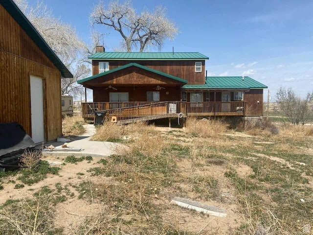 7413 W 7250 S, Myton, UT 84052 - rear view of house with a chimney, a deck, ceiling fan, and metal roof