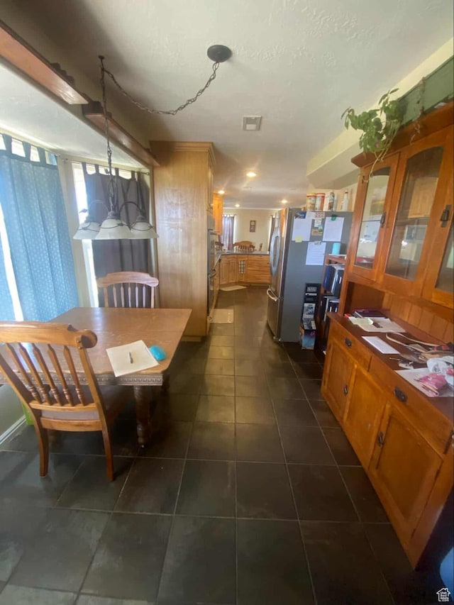 7413 W 7250 S, Myton, UT 84052 - dining room with dark tile patterned floors and visible vents