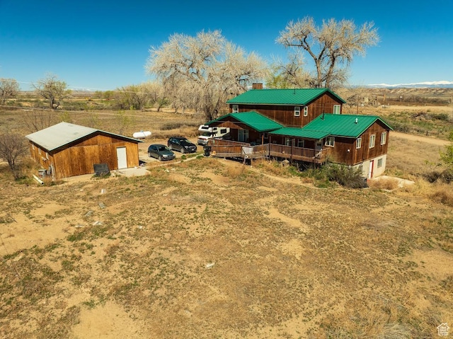 7413 W 7250 S, Myton, UT 84052 - view of yard featuring a rural view, a deck, and a garage