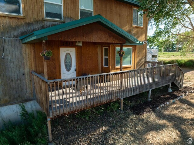 7413 W 7250 S, Myton, UT 84052 - doorway to property featuring a wooden deck