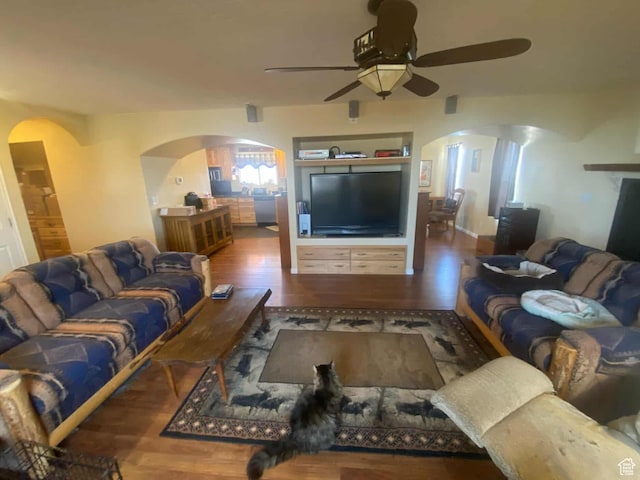 7413 W 7250 S, Myton, UT 84052 - living area featuring ceiling fan, arched walkways, and wood finished floors