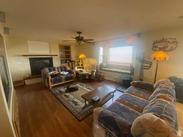 7413 W 7250 S, Myton, UT 84052 - living room featuring a glass covered fireplace, baseboards, wood finished floors, and ceiling fan