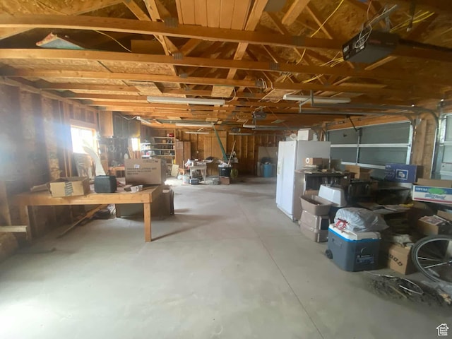 7413 W 7250 S, Myton, UT 84052 - misc room with concrete flooring, a workshop area, and a garage