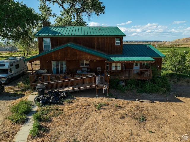 7413 W 7250 S, Myton, UT 84052 - chalet / cabin featuring a metal roof and a porch