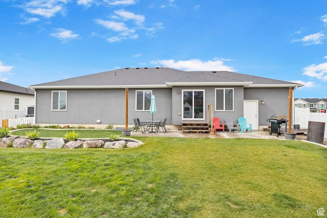 rear view of house with fence, a patio, and entry steps