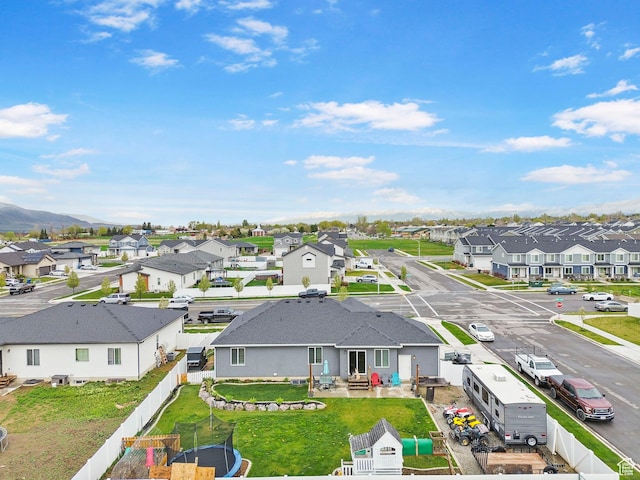 birds eye view of property with a residential view