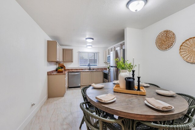 dining room with baseboards and marble finish floor