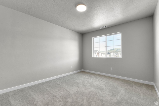 6622 W Spring Snow Ln, Herriman, UT 84096 - empty room with light colored carpet, a textured ceiling, and baseboards