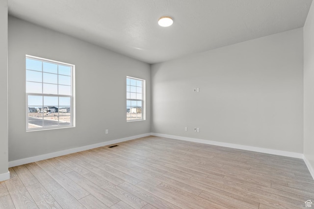 6622 W Spring Snow Ln, Herriman, UT 84096 - spare room featuring light wood finished floors and baseboards