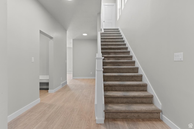 6622 W Spring Snow Ln, Herriman, UT 84096 - staircase with wood finished floors, recessed lighting, and baseboards