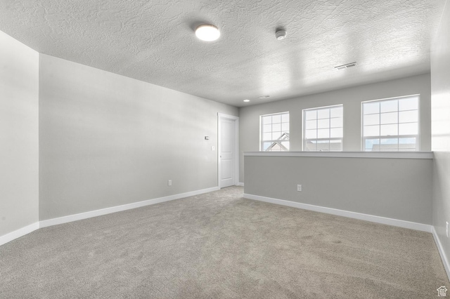 6622 W Spring Snow Ln, Herriman, UT 84096 - carpeted empty room featuring a textured ceiling, baseboards, and a smoke detector