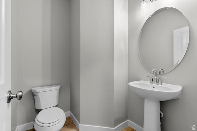 6622 W Spring Snow Ln, Herriman, UT 84096 - half bath with toilet, baseboards, and wood finished floors