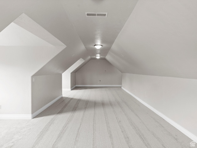 337 W Paddock Ln S, Kaysville, UT 84037 - additional living space featuring baseboards, carpet flooring, lofted ceiling, and visible vents
