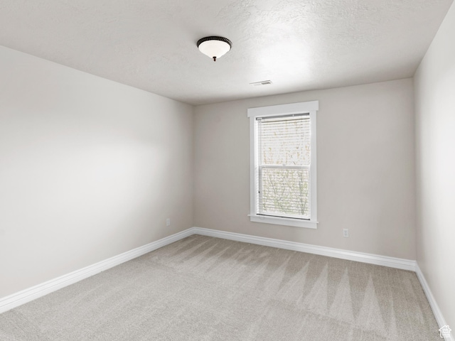 337 W Paddock Ln S, Kaysville, UT 84037 - empty room featuring a textured ceiling, baseboards, light colored carpet, and visible vents