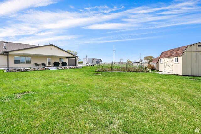 4990 W 12000 N, Tremonton, UT 84337 - view of yard featuring an outbuilding, a patio, and a storage unit
