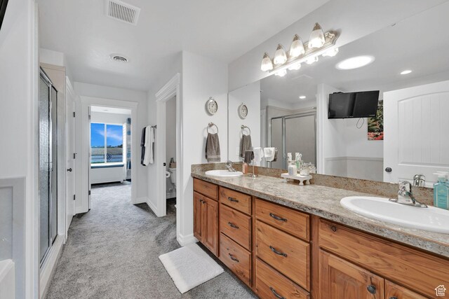4990 W 12000 N, Tremonton, UT 84337 - full bathroom with a shower stall, a sink, visible vents, and double vanity