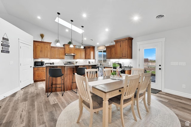 4990 W 12000 N, Tremonton, UT 84337 - dining space featuring recessed lighting, light wood finished floors, vaulted ceiling, visible vents, and baseboards