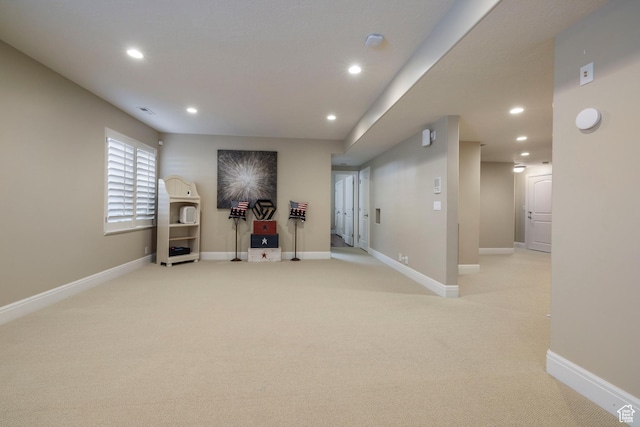 workout area featuring recessed lighting and light colored carpet